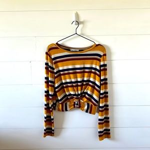 Long sleeve striped shirt with colors yellow, navy, white, tan, and maroon.